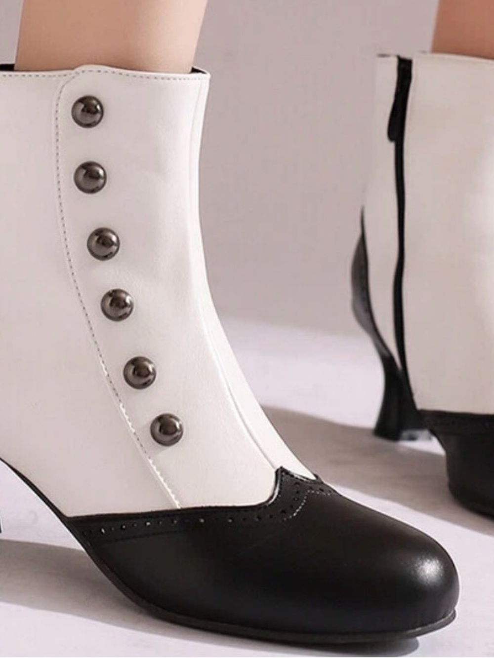Black and white vintage inspired Victorian boots with retro button details